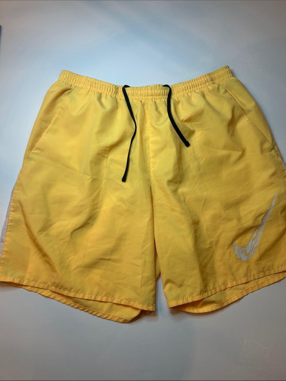 Nike Men's bright Yellow Athletic Shorts with weathered swoosh, pockets, sz L